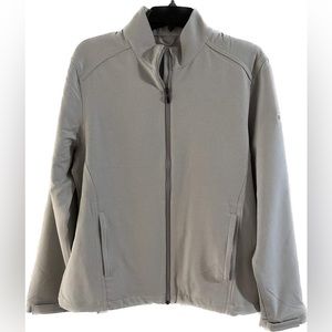 NWOT Greg Norman windbreaker with deep zippered pockets, inner drawstring, logo